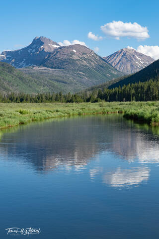 mountain peaks reflecting in the river at Christmas Meadows, Utah