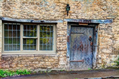 Old cottage door and window in the Cotswolds, England.