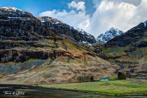 Glen Coe Scotland, snow capped mountains and small crofters hut