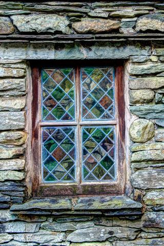 Window in old rock building at Grasmere, England