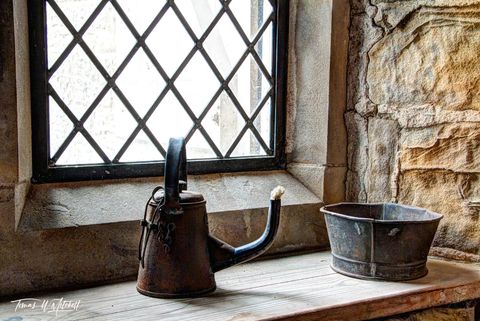 still life of oil can and window at Stainsby Mill, England