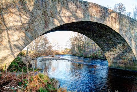 Old stone bridge over River Nairn, Scotland