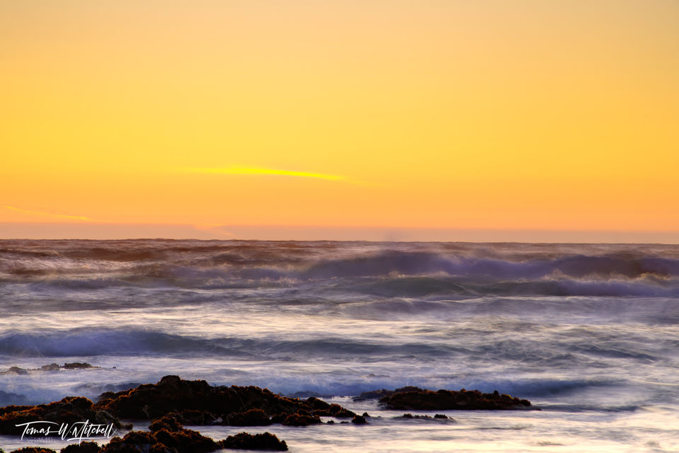 Yellow sunset on ocean beach in CA