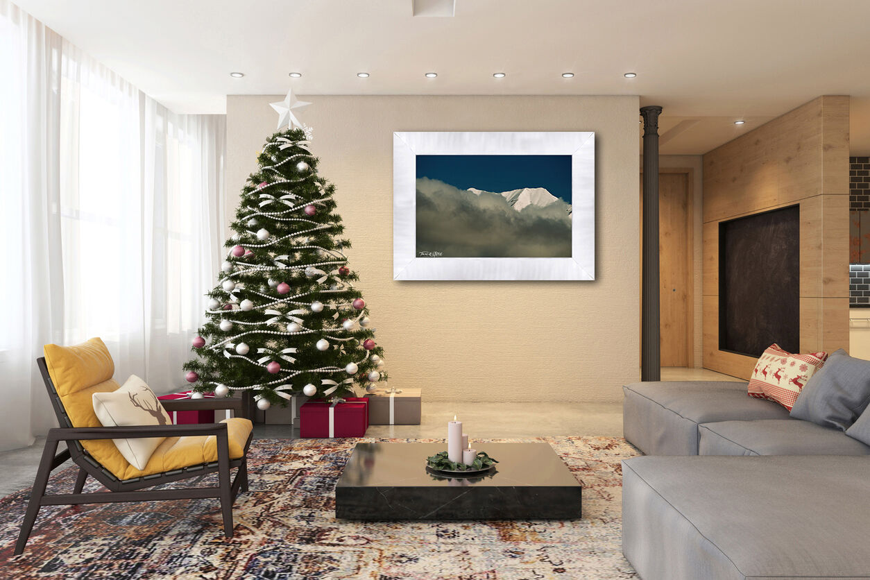 framed photograph of snow covered mountain on home wall