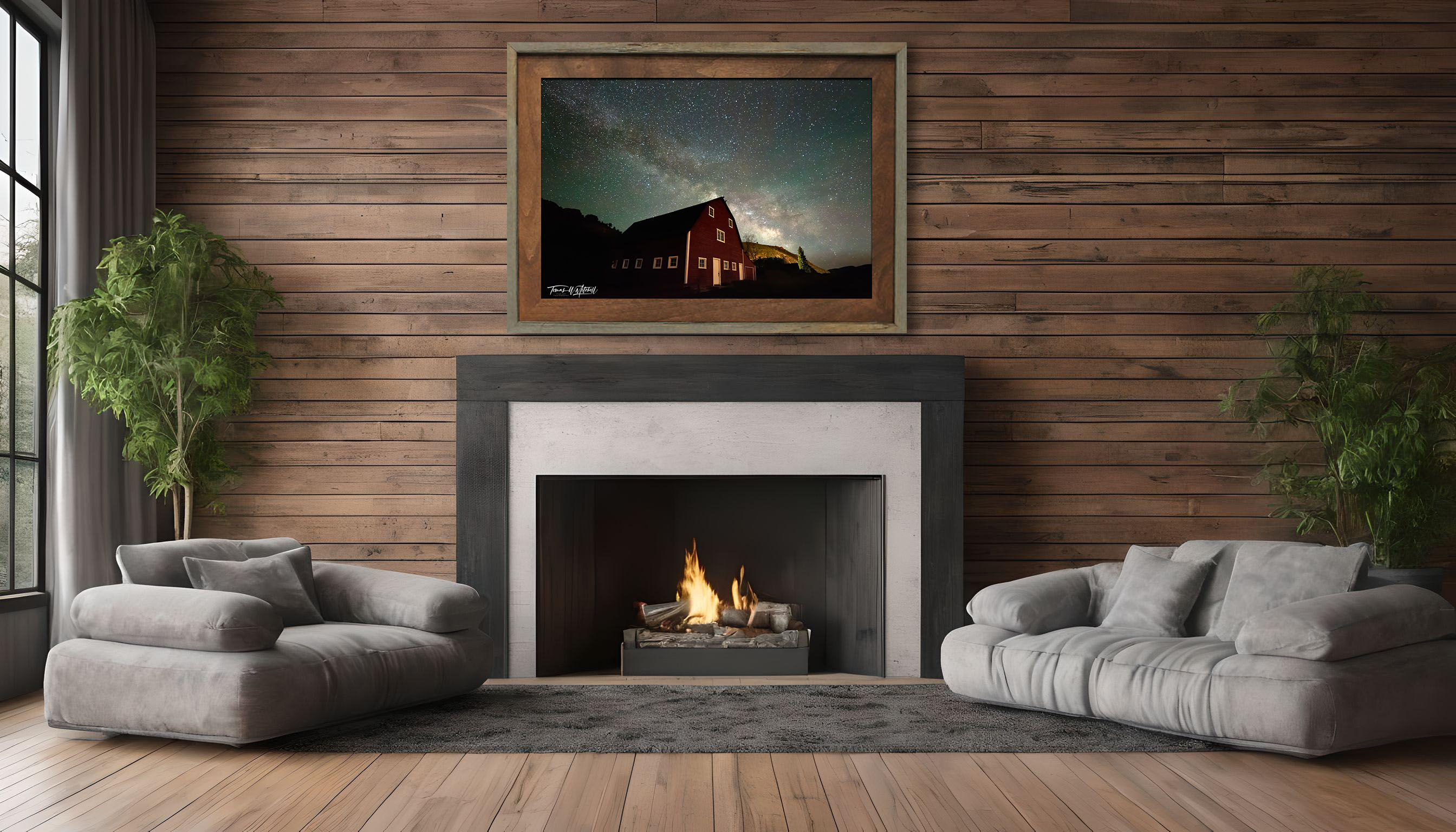 framed photograph of red barn and night sky milky way on home wall
