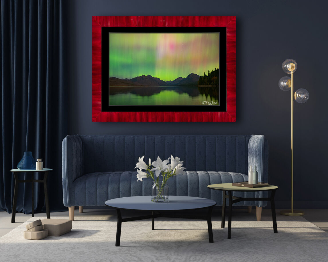 framed photograph of norther nights over Glacier National park on home wall.