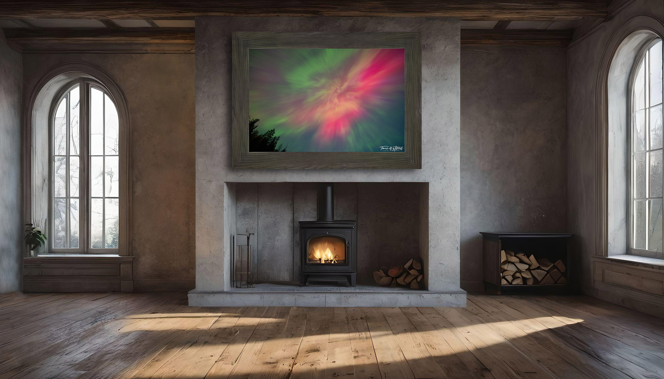 framed photograph of northern lights on home wall