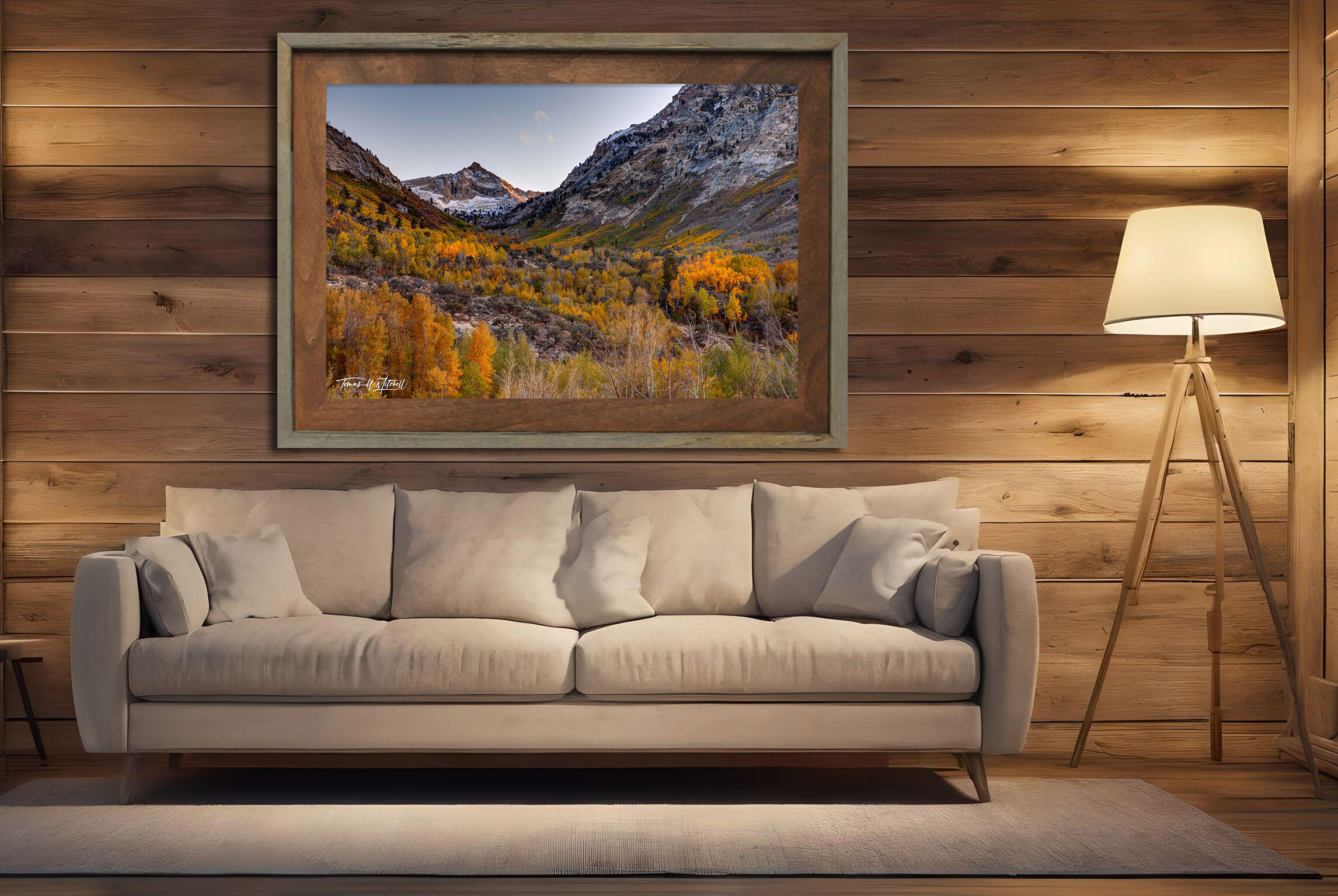 framed photograph of mountains in autumn on home wall