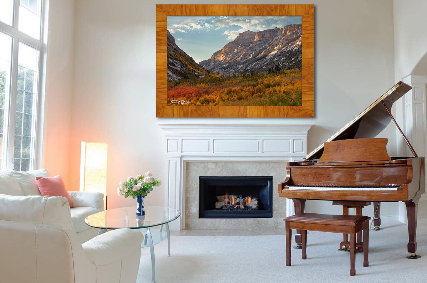 framed photograph of fall scene in the mountains on home wall.