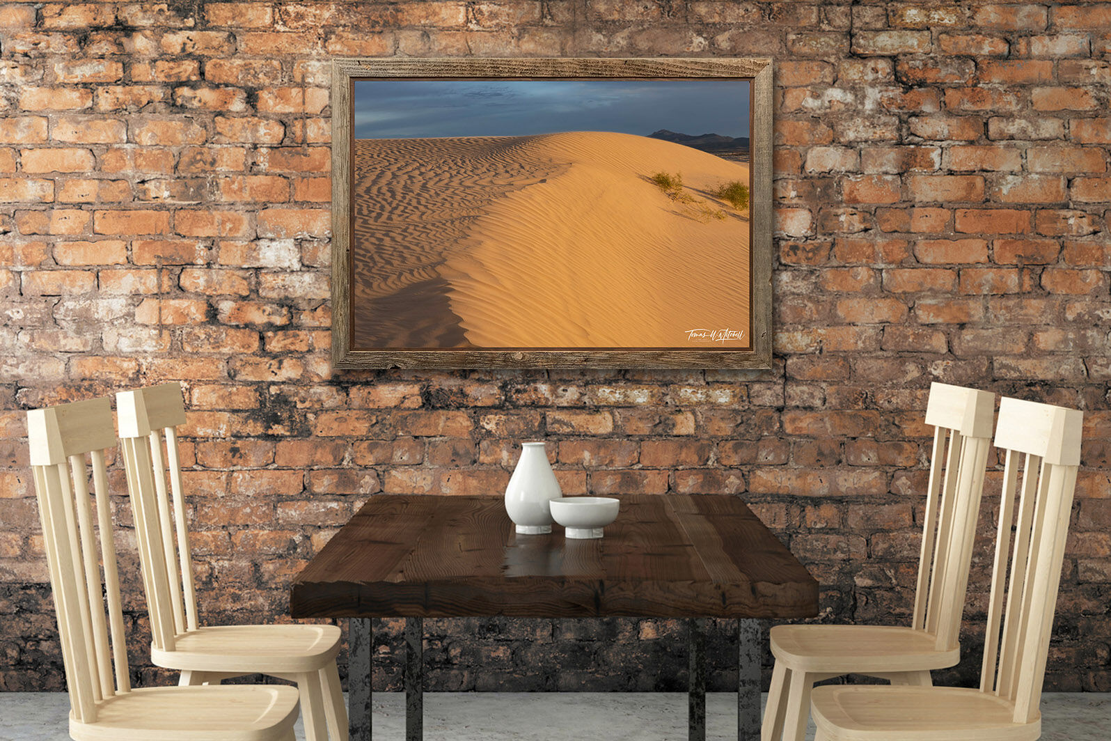 framed photograph of sand dune on restaurant wall.