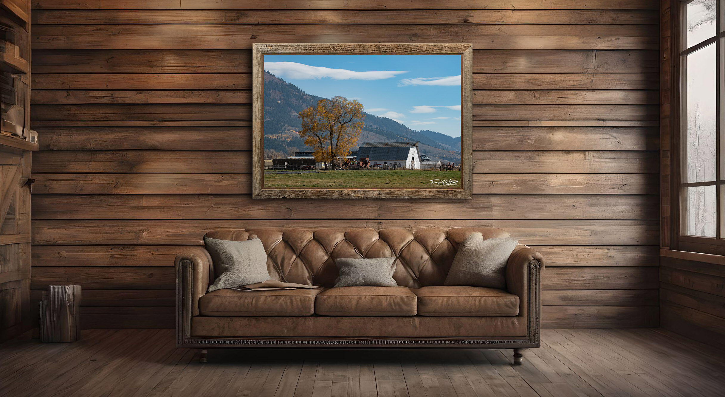framed photograph of barn in autumn light on home wall