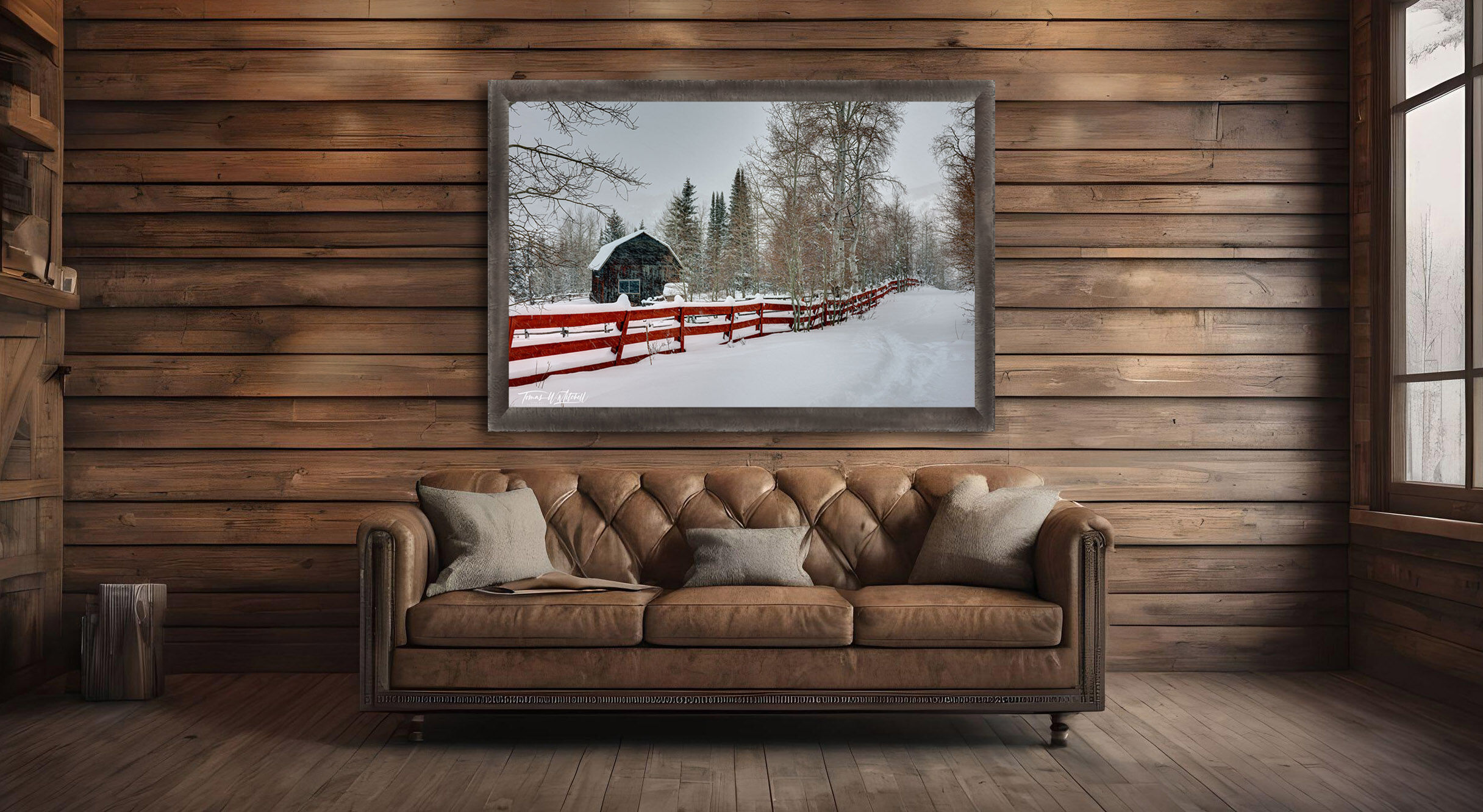 framed photograph of barn and red fence in snow storm