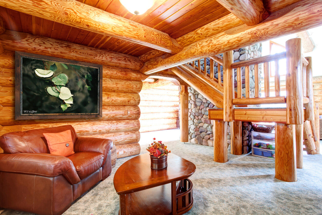 framed photograph of leaves in water on cabin wall