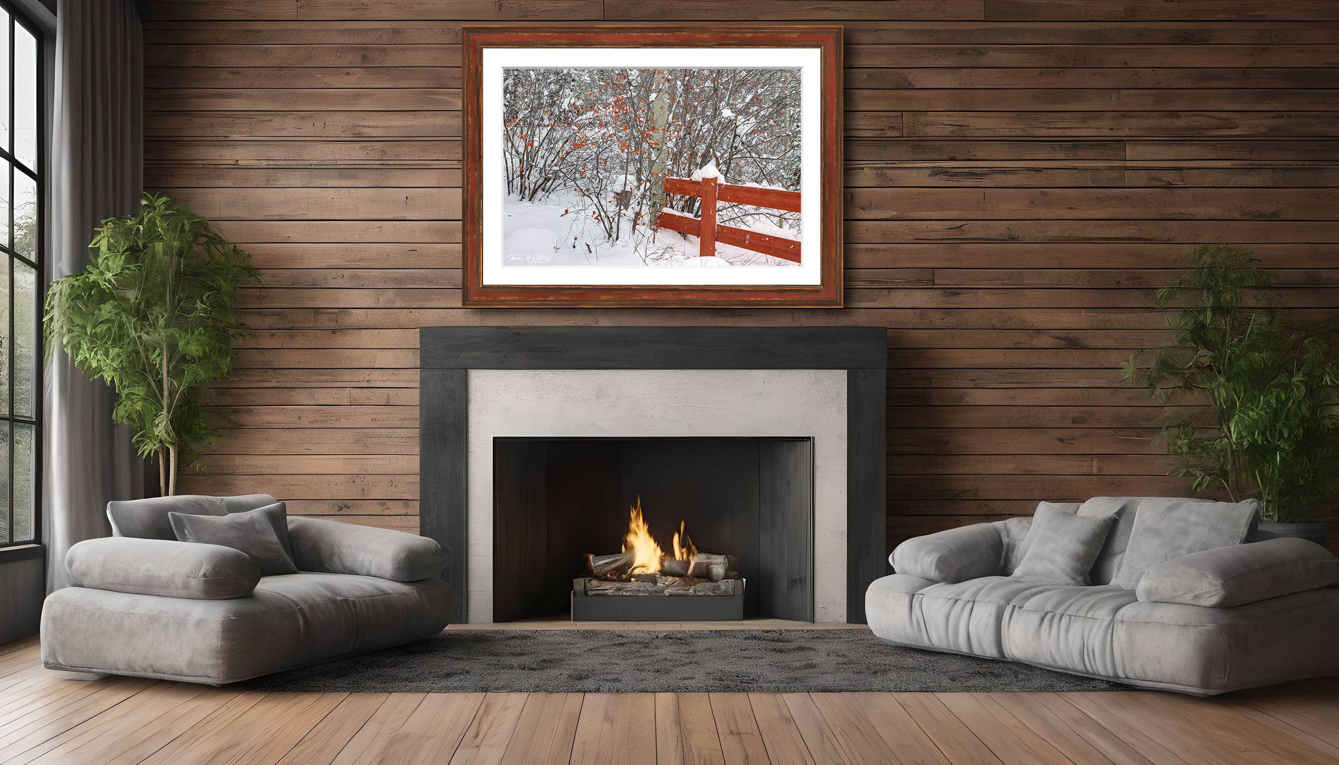 framed photograph of red fence covered in winter snow on home wall