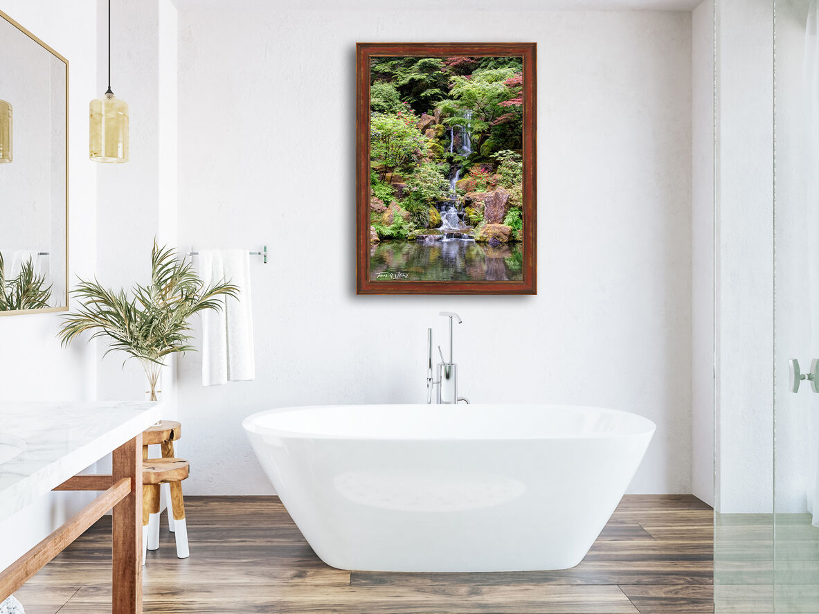 framed photograph of waterfall on bathroom wall