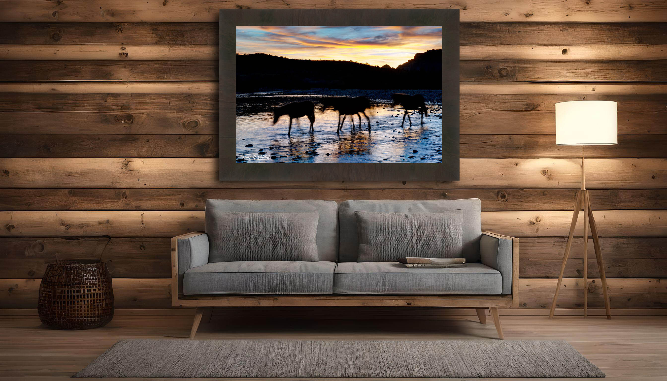 framed photograph of wild horses on river with sunset.