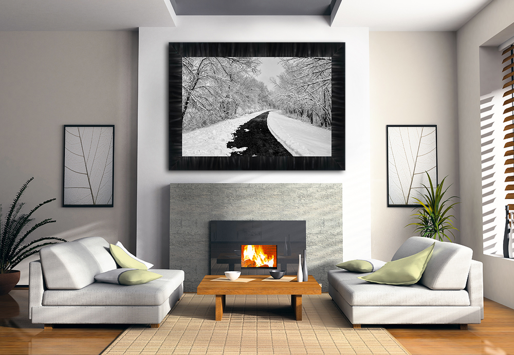 framed photograph of winter scene with trail on home wall