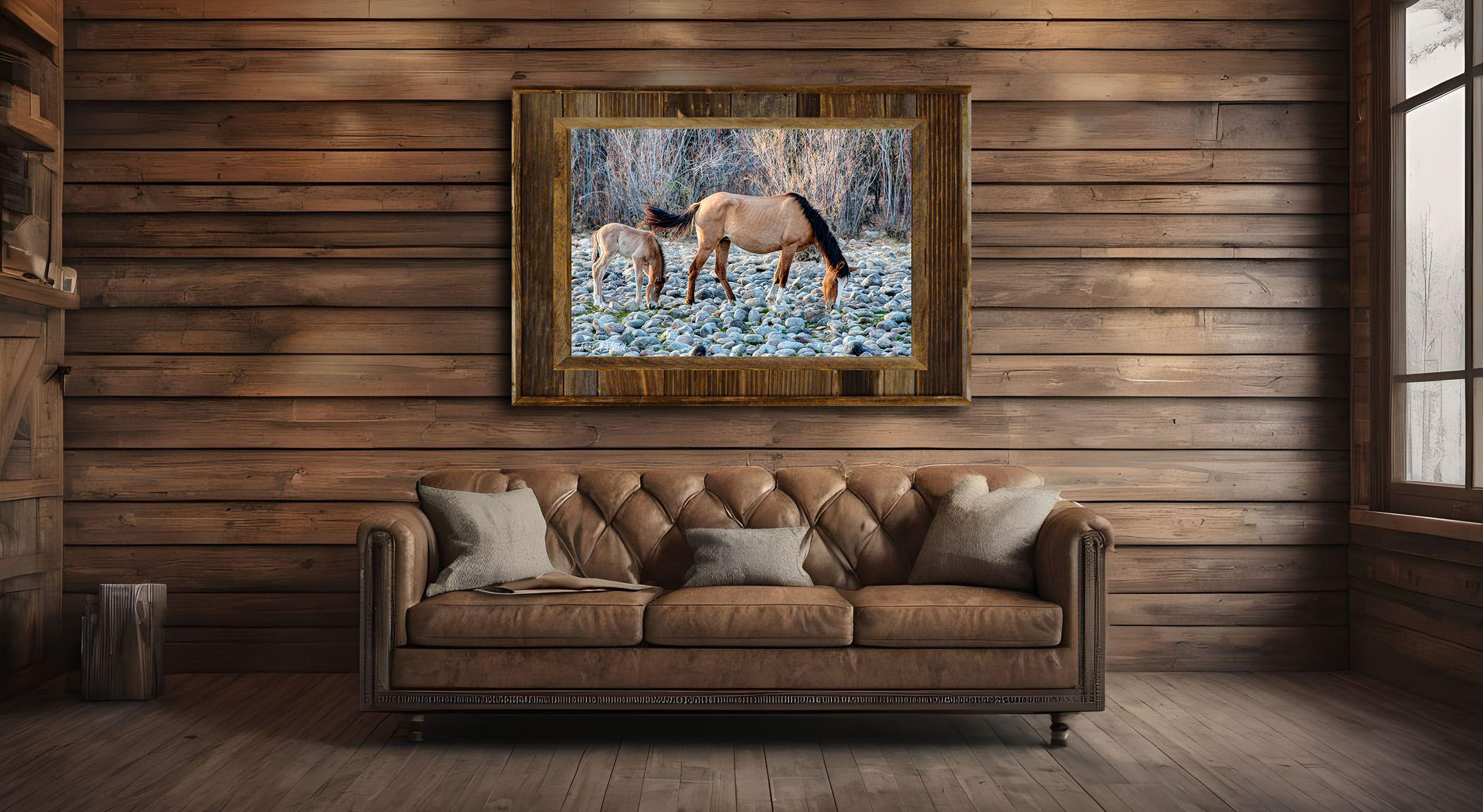 framed photograph of wild horses on home wall