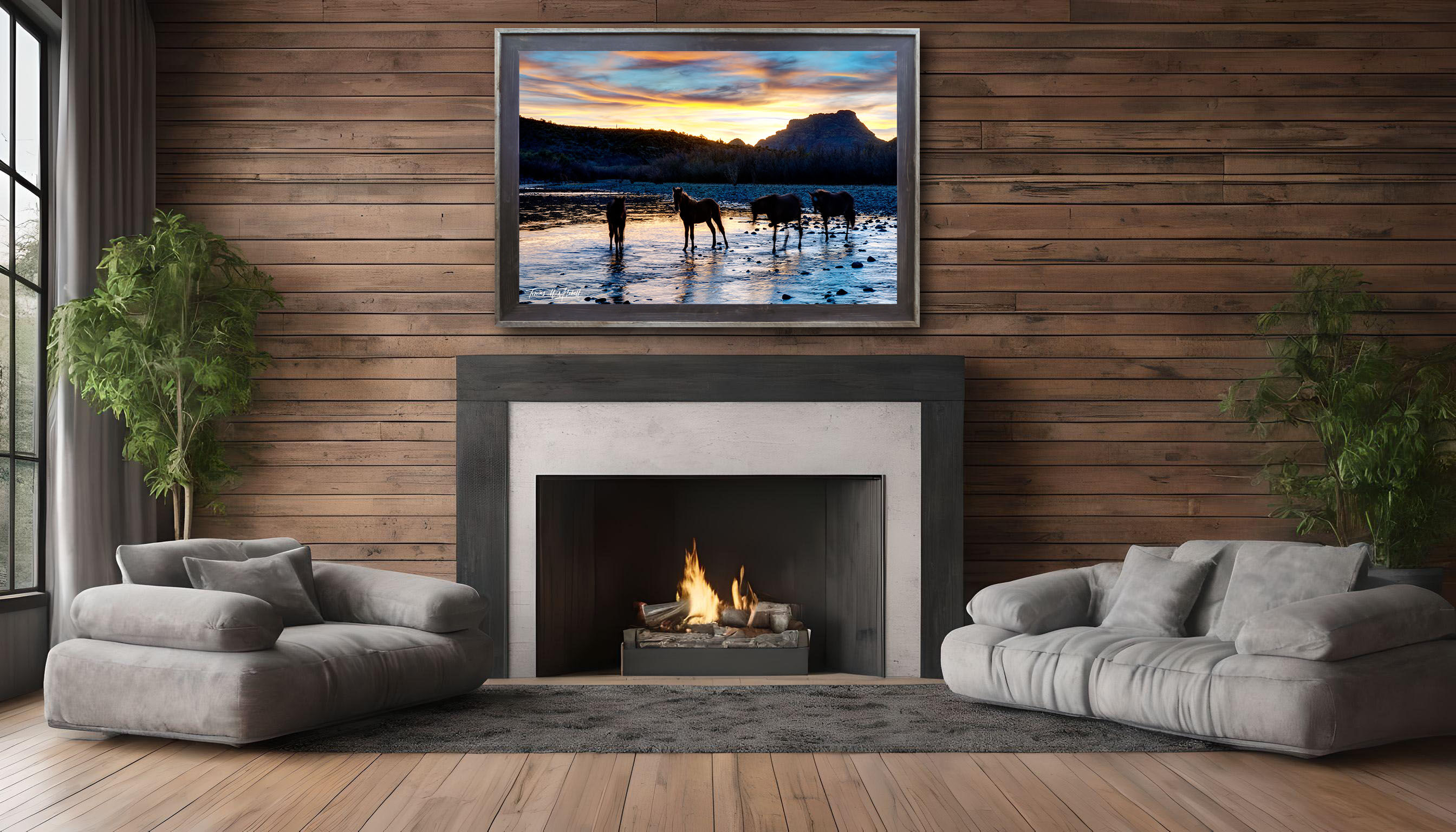 framed photograph of wild horses sunset river on home wall