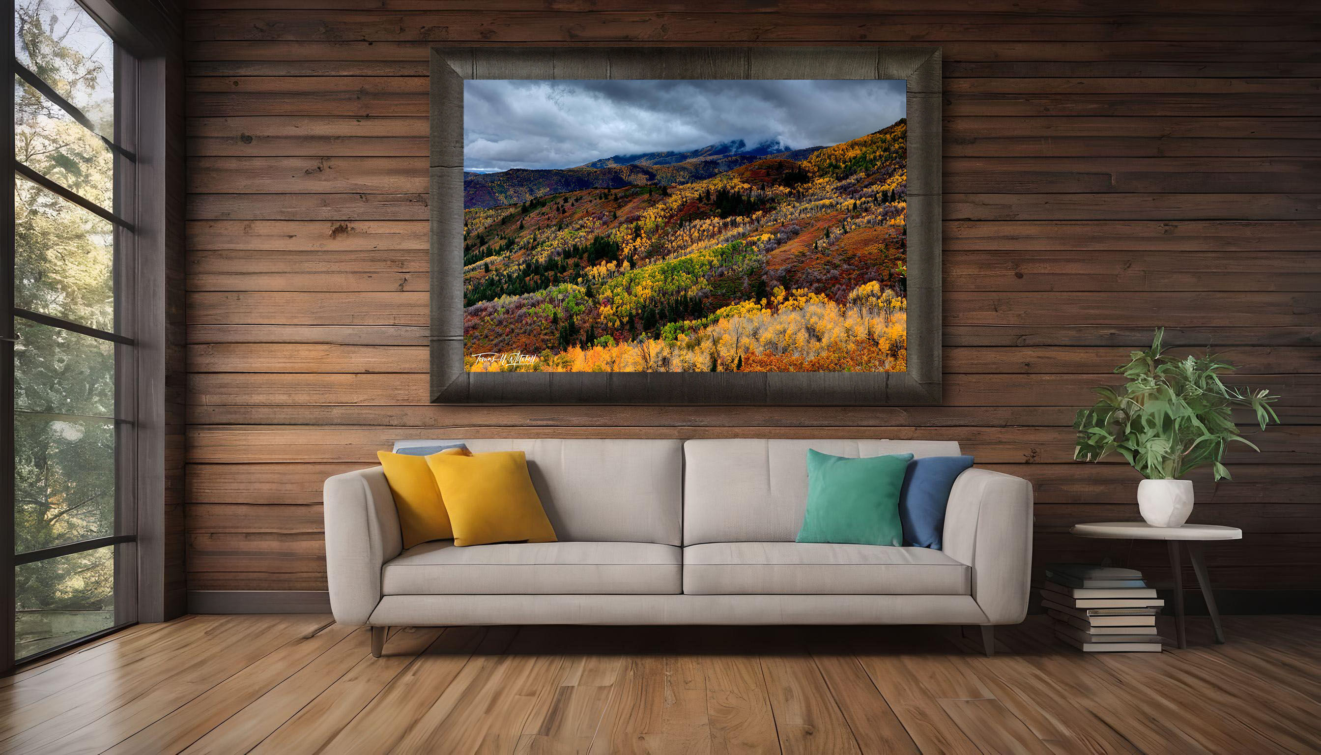 framed photograph of mountains in autumn on home wall